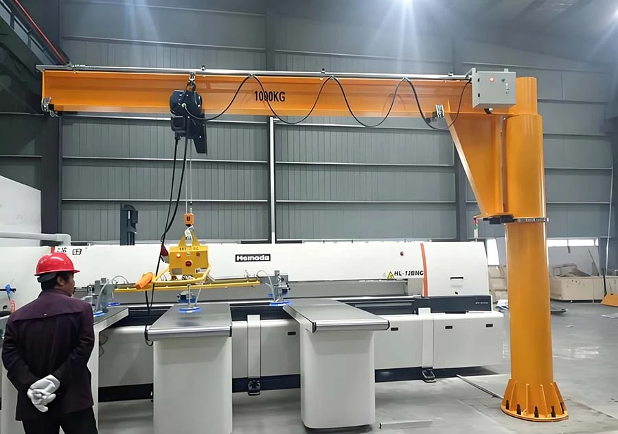 Jib crane lifting a component at a workstation Jib crane lifting a component at a workstation